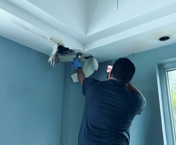 Certified inspector from Air Doctors conducting mold inspections, mold testing, particle count and allergen testing, asbestos surveys, sample collection, and water quality testing in a residential and commercial property in South Florida.