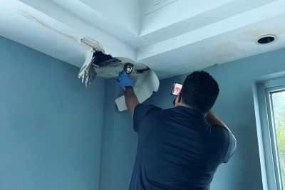 Certified inspector from Air Doctors conducting mold inspections, mold testing, particle count and allergen testing, asbestos surveys, sample collection, and water quality testing in a residential and commercial property in South Florida.