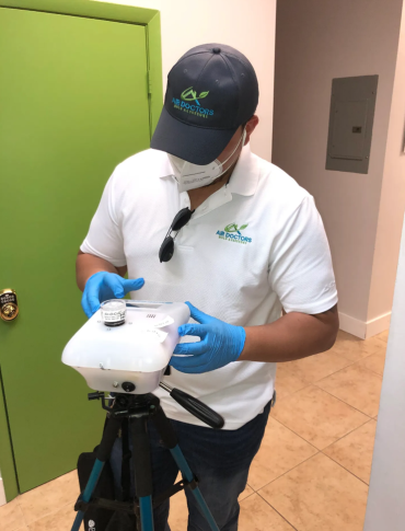 Certified inspector from Air Doctors conducting mold inspections, mold testing, particle count and allergen testing, asbestos surveys, sample collection, and water quality testing in a residential and commercial property in South Florida.