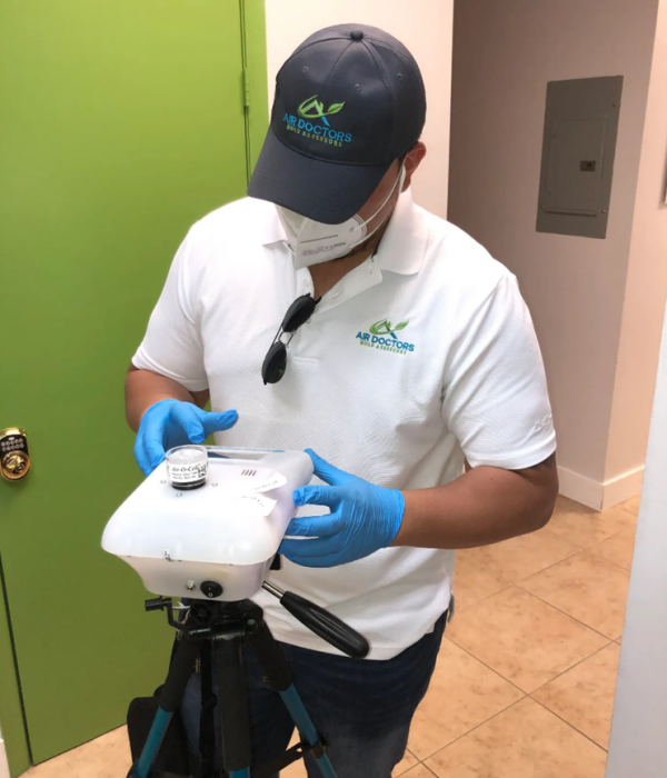 Certified inspector from Air Doctors conducting mold inspections, mold testing, particle count and allergen testing, asbestos surveys, sample collection, and water quality testing in a residential and commercial property in South Florida.